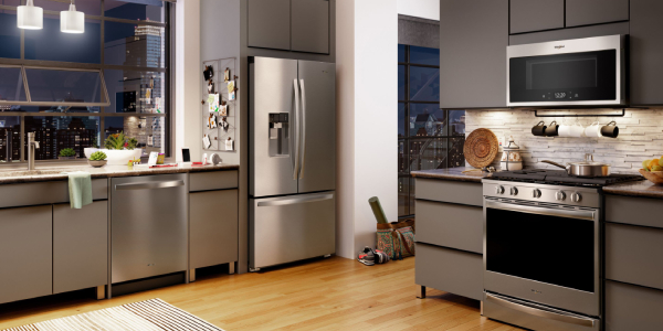 An Image of Modern, bright, clean, kitchen interior with stainless steel appliances in a luxury house.